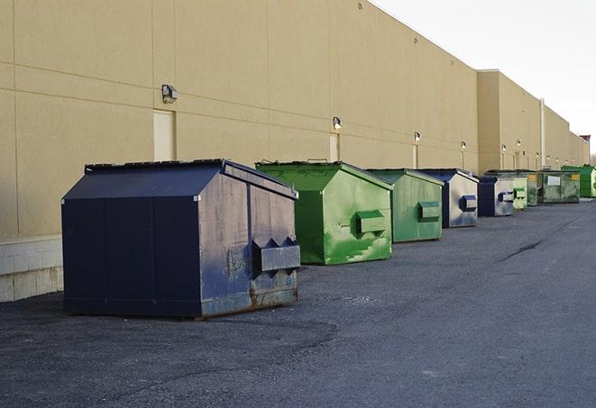 brightly colored dumpsters filled with construction waste in Arden